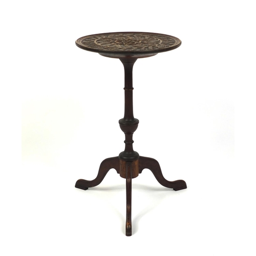 96 - Oak tripod wine table, the top carved with thistles, 55cm high x 33cm in diameter