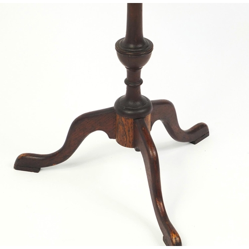 96 - Oak tripod wine table, the top carved with thistles, 55cm high x 33cm in diameter