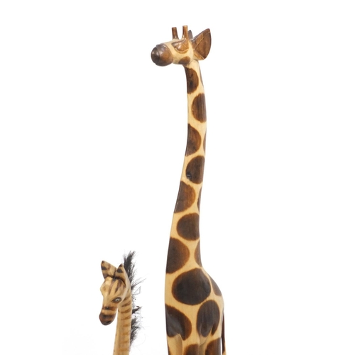 185 - Four wooden giraffes, the largest 150cm high