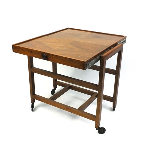 119 - Quarter veneered walnut cantilever tea trolley, 87cm high x 61cm wide x 39cm deep