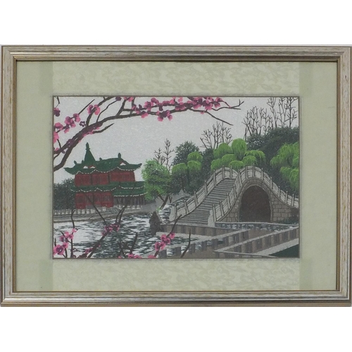 465 - Oriental silk tapestry of a bridge and a pagoda, 47cm x 37cm excluding the frame