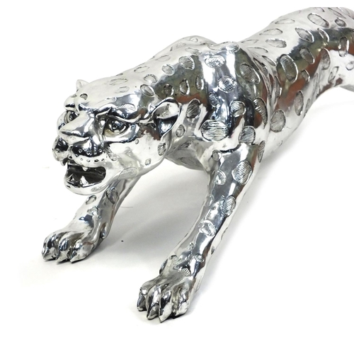 182 - Large decorative silvered leopard, 110cm long