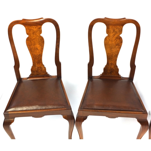 98 - Set of four walnut Queen Anne style dining chairs with brown leather drop in seats, 95cm high