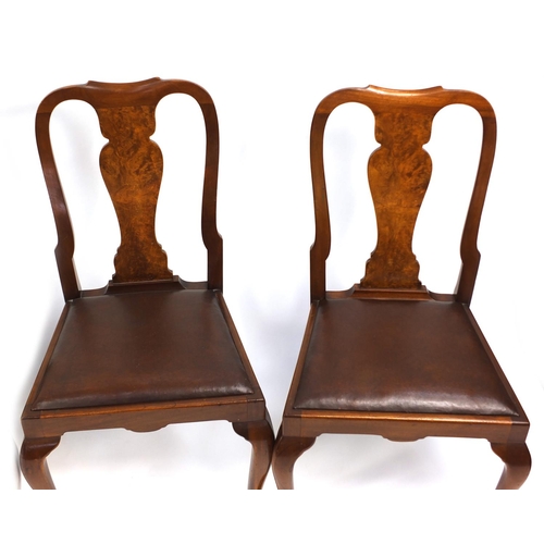 98 - Set of four walnut Queen Anne style dining chairs with brown leather drop in seats, 95cm high