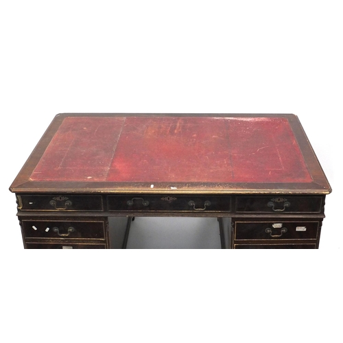 116 - Mahogany twin pedestal partners desk with tooled red leather top, 78cm high x 153cm wide x 93cm deep