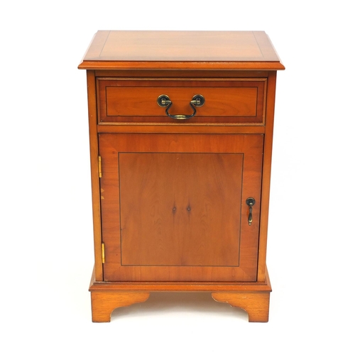 126 - Inlaid yew night stand fitted with a frieze drawer above a cupboard door, 66cm high x 44cm wide x 31... 