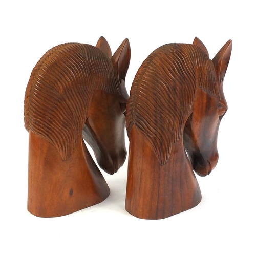 662 - Pair of large carved wooden horse head busts, 30cm high