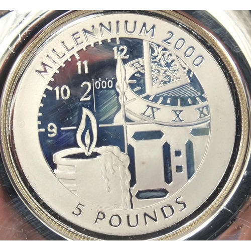 2299 - Millennium 2000 commemorative silver pin dish with inset five pound coin, together with a Millennium... 