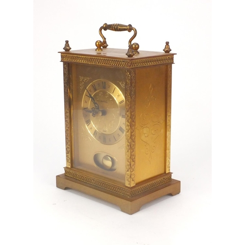 2080 - James Walker brass mantle clock with floral decoration, 22cm high excluding the handle