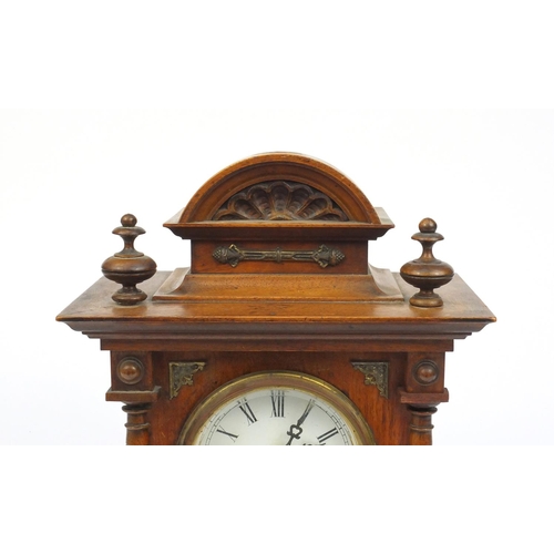 2122 - Walnut cased Junghans mantle clock with enamelled dial and Roman numerals, 35 cm high