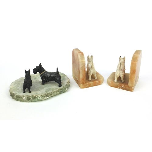 2127 - Pair of alabaster book ends, each mounted with a Scotty dog, together with a stone ashtray mounted w... 