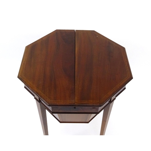 2014 - Victorian inlaid mahogany octagonal work box, with lift out fitted interior raised on tapering legs,... 