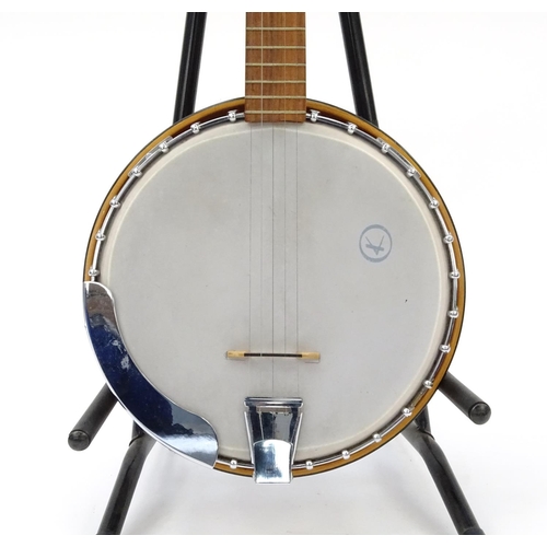 2175 - Mother of Pearl inlaid banjo with rosewood back and protective case, 98cm in length