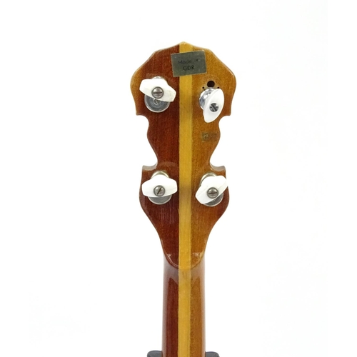 2175 - Mother of Pearl inlaid banjo with rosewood back and protective case, 98cm in length