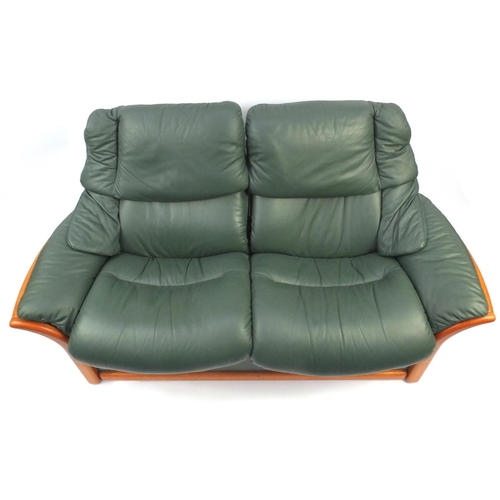 2007 - Stressless Ekornes reclining two seater settee with green leather upholstery, 173cm long