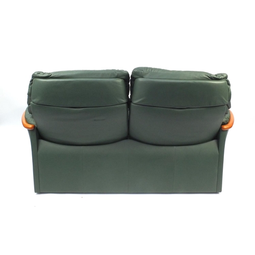 2007 - Stressless Ekornes reclining two seater settee with green leather upholstery, 173cm long