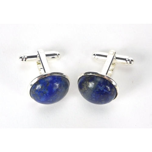 2531 - Pair of white metal cabochon lapis lazuli cuff link, 1.6cm in diameter, approximate weight 11.0g