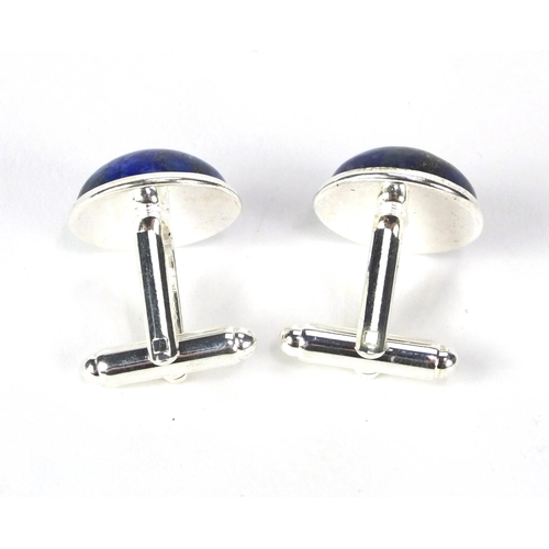 2531 - Pair of white metal cabochon lapis lazuli cuff link, 1.6cm in diameter, approximate weight 11.0g