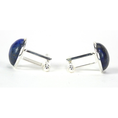 2531 - Pair of white metal cabochon lapis lazuli cuff link, 1.6cm in diameter, approximate weight 11.0g