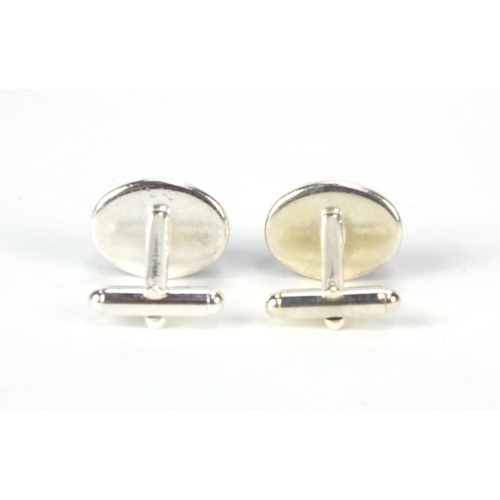 2533 - Pair of white metal cabochon lapis lazuli cufflinks, 2cm long, approximate weight 12.2g