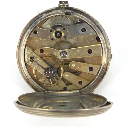 2535 - Ladies silver pocket watch with floral chased decoration and ornate silvered dial, 3.8cm in diameter... 