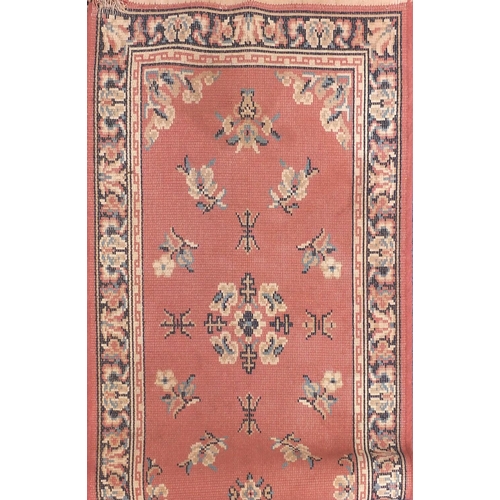 154 - Three assorted rugs two with geometric pattern and a salmon carpet runner