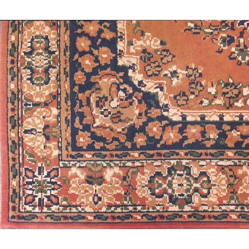 154 - Three assorted rugs two with geometric pattern and a salmon carpet runner