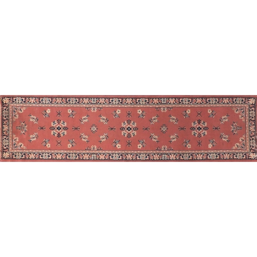 154 - Three assorted rugs two with geometric pattern and a salmon carpet runner