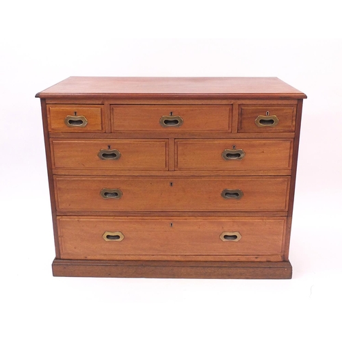 45 - Hardwood chest fitted with a series of seven drawers with inset bass hands, 84cm high x 107cm wide x... 