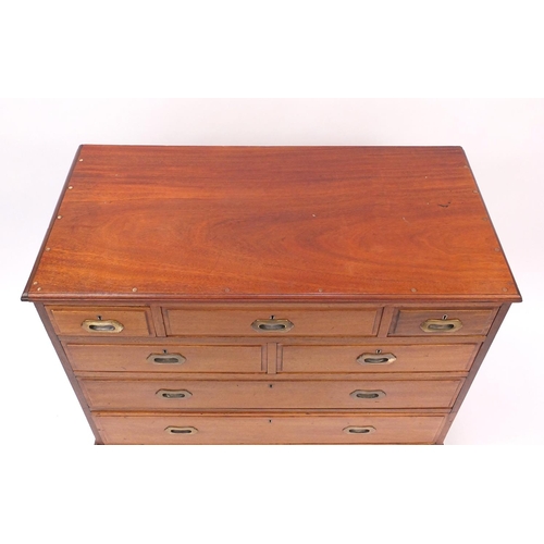 45 - Hardwood chest fitted with a series of seven drawers with inset bass hands, 84cm high x 107cm wide x... 