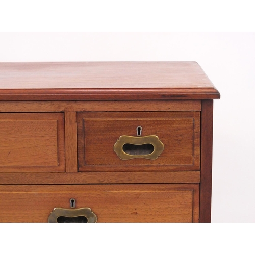 45 - Hardwood chest fitted with a series of seven drawers with inset bass hands, 84cm high x 107cm wide x... 