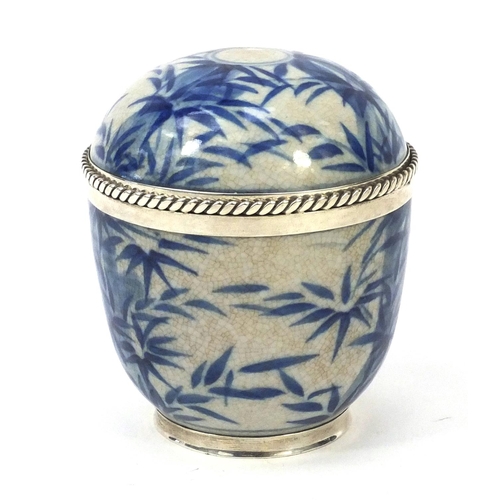 409 - Sterling silver mounted Oriental porcelain pot and cover decorated with bamboo, 10cm high