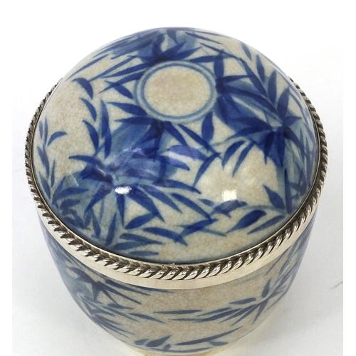 409 - Sterling silver mounted Oriental porcelain pot and cover decorated with bamboo, 10cm high