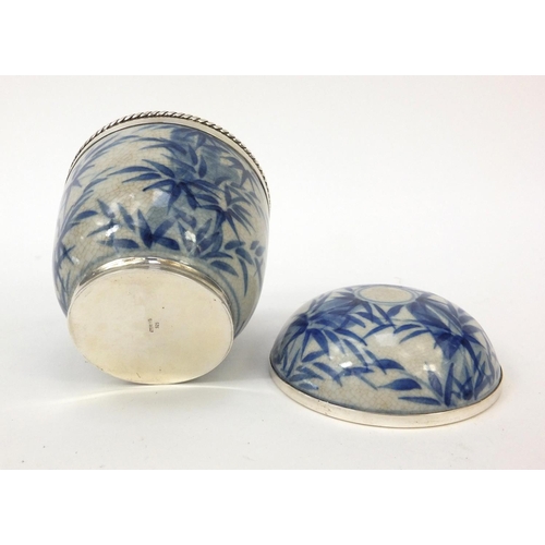 409 - Sterling silver mounted Oriental porcelain pot and cover decorated with bamboo, 10cm high