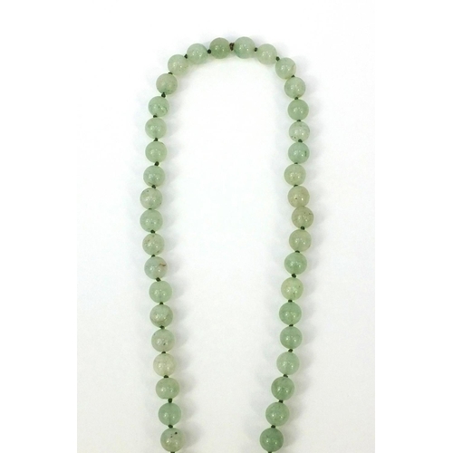 373 - Oriental carved jadeite bead necklace with pendant, 66cm long