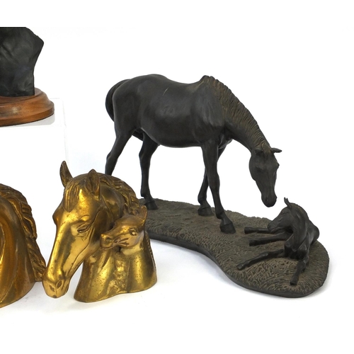 237 - Three bronze style horse groups and a pair of brass horse bust book ends, the largest 37cm long