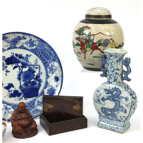 553 - Oriental items including a stoneware ginger jar and cover, blue and white charger, lacquered box and... 