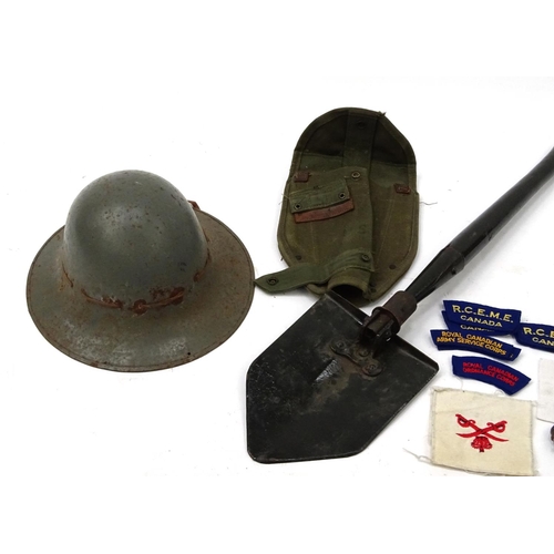 805 - Group of Military items including a US spade, tin helmet and cloth insignia