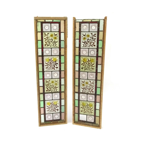 2053 - Pair of leaded stained glass window panels, each with floral panels, each 111cm x 30cm