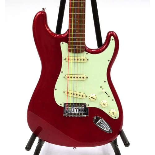 2174 - Jim Deacon red electric guitar with six strings, 99cm in length