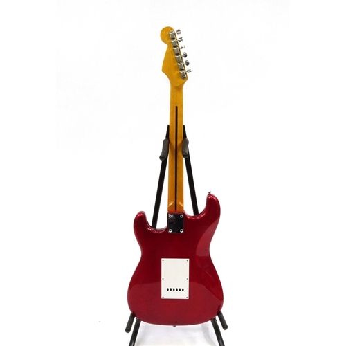 2174 - Jim Deacon red electric guitar with six strings, 99cm in length