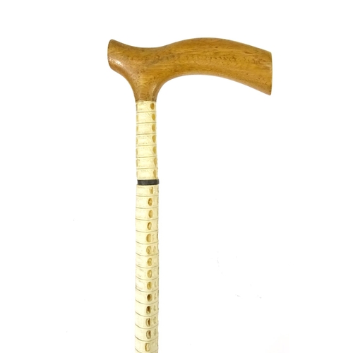 254 - Whale vertebrae walking cane, 87cm long