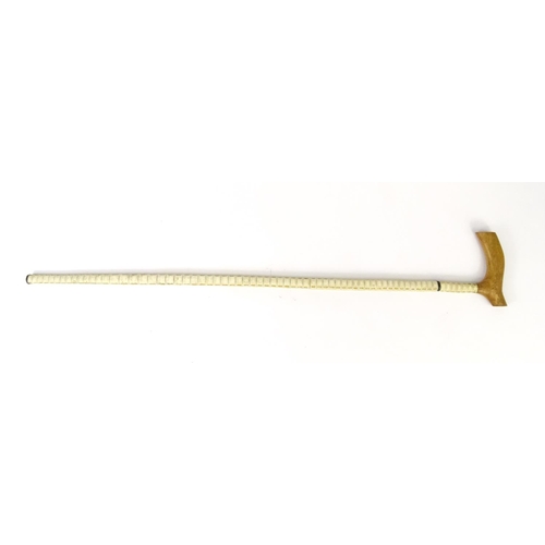 254 - Whale vertebrae walking cane, 87cm long