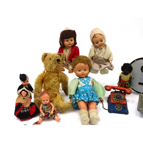 554 - Vintage toys including a boxed Vulcan sewing machine, tin plate telephone, dolls and a Selcol banjo