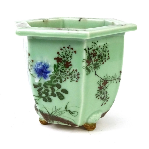 544 - Oriental porcelain hexagonal planter, decorated with flowers, 20cm high