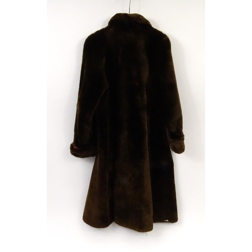 697 - Full length brown fur coat, 120cm in length