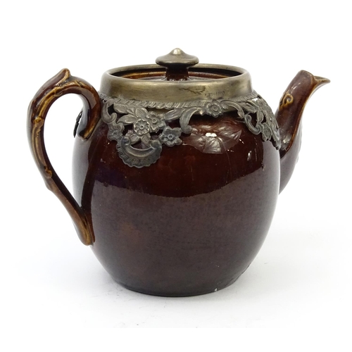 677 - Treacle glazed pottery teapot with silver mount, Birmingham hallmarked, 13cm high