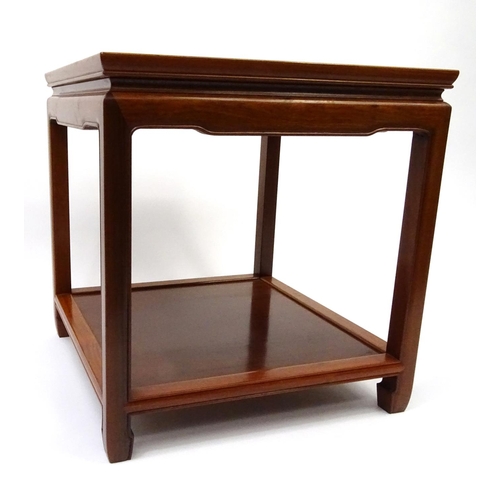 63 - Oriental hardwood occasional table with under tier, 59cm high x 56cm square