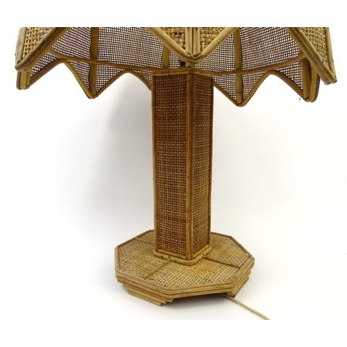 721 - Wicker cane table lamp and shade, 65cm high