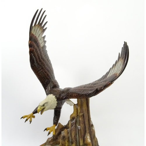 201 - Large painted metal study of a swooping eagle, 44cm high